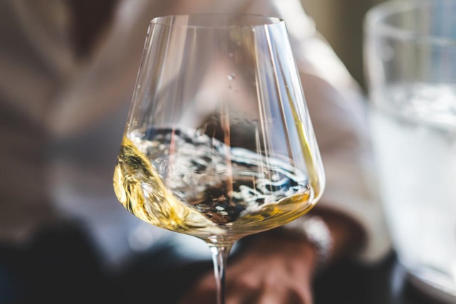 Close-up of white wine in a crystal wine glass